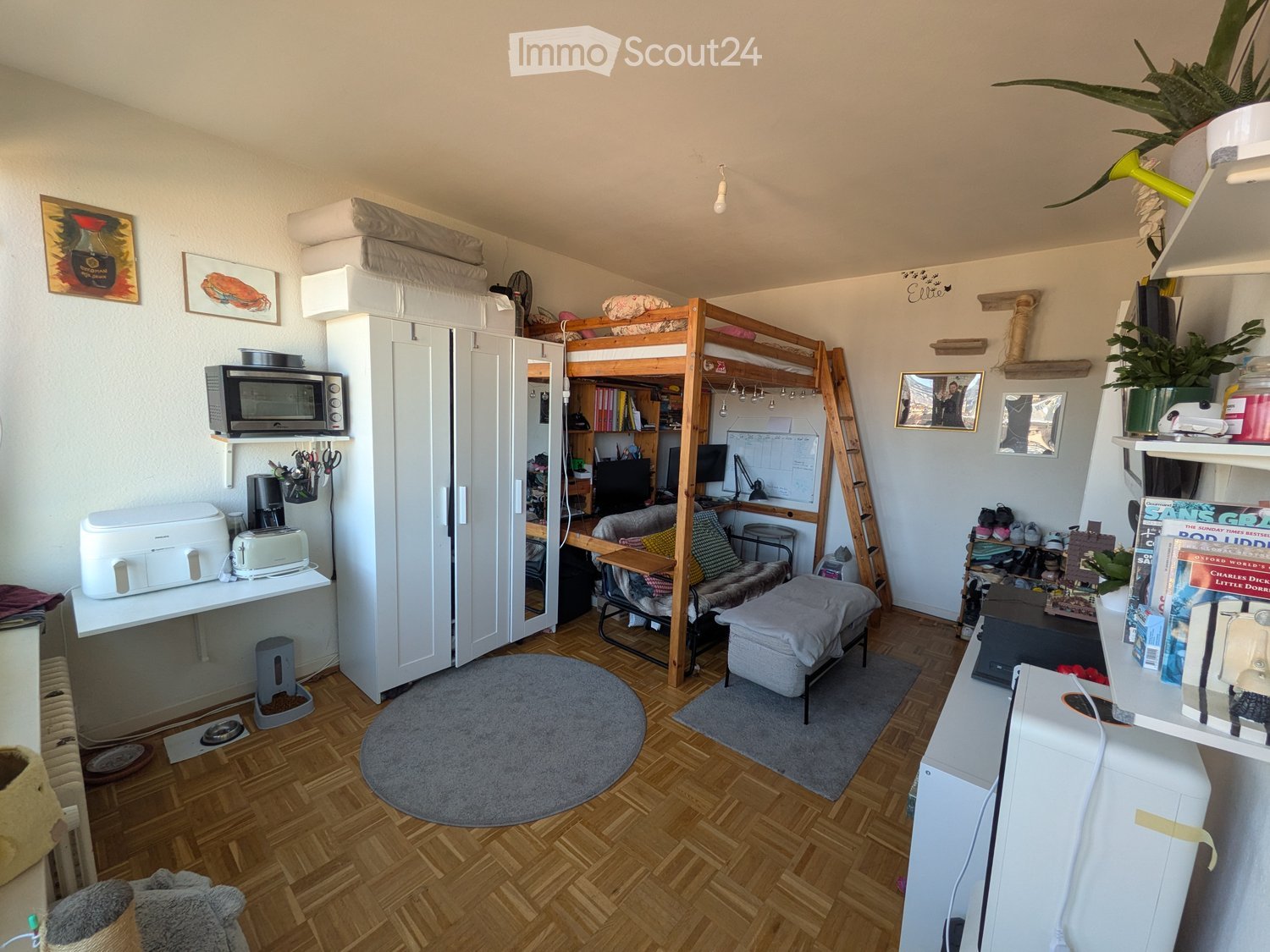 {"type": "Furnished Room", "objects": ["microwave", "toaster", "printer", "stool", "chair", "table", "laptop", "cat litter", "cat bed", "books", "picture frame", "stool", "stool", "stool", "stool", "stool", "stool", "stool", "stool", "stool", "stool", "st