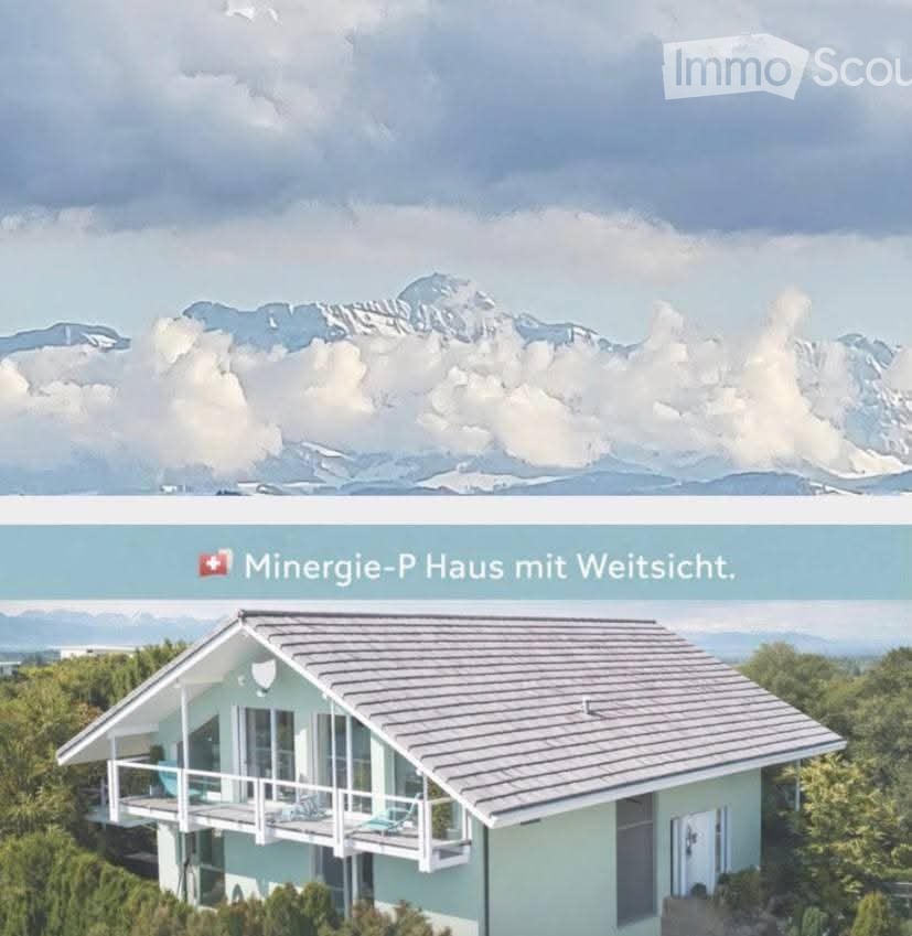 Modern house with a grey roof and light blue walls, surrounded by greenery, with a scenic mountain view in the background.