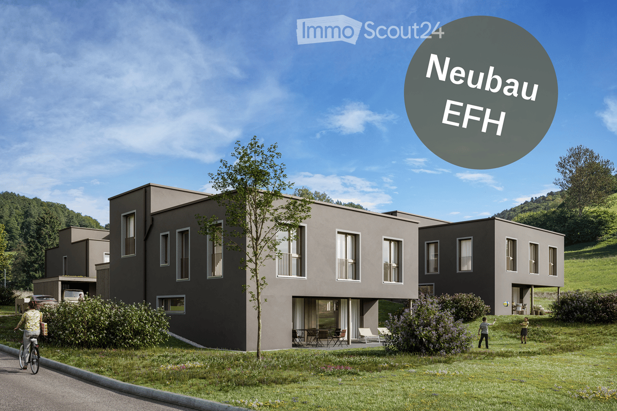 Modern two-story house with grey exterior, large windows, and a small garden area with outdoor seating.