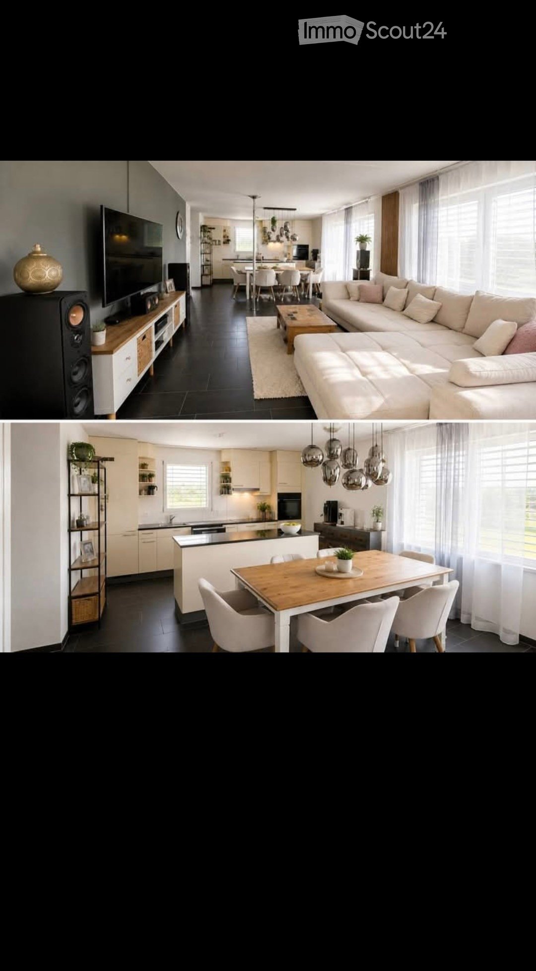 Modern open-plan living and dining area with a large sectional sofa, coffee table, TV stand with speakers, dining table with chairs, and a kitchen island with pendant lights.