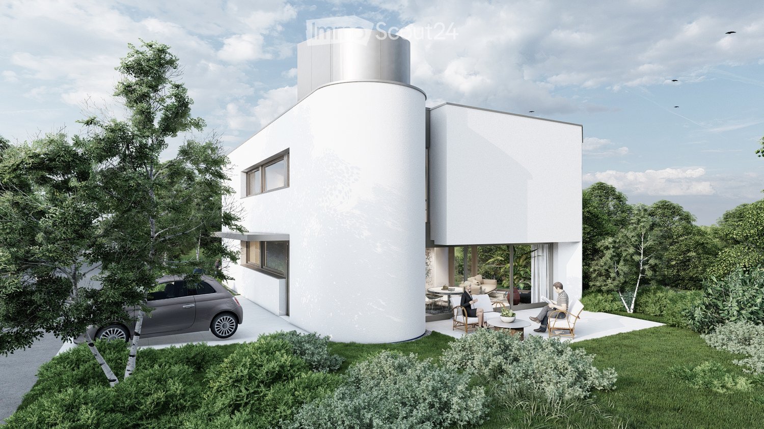 Modern two-story house with white exterior, cylindrical tower, large windows, and a raised ground floor. Includes a small outdoor seating area with chairs and a table, surrounded by greenery and a parked car.