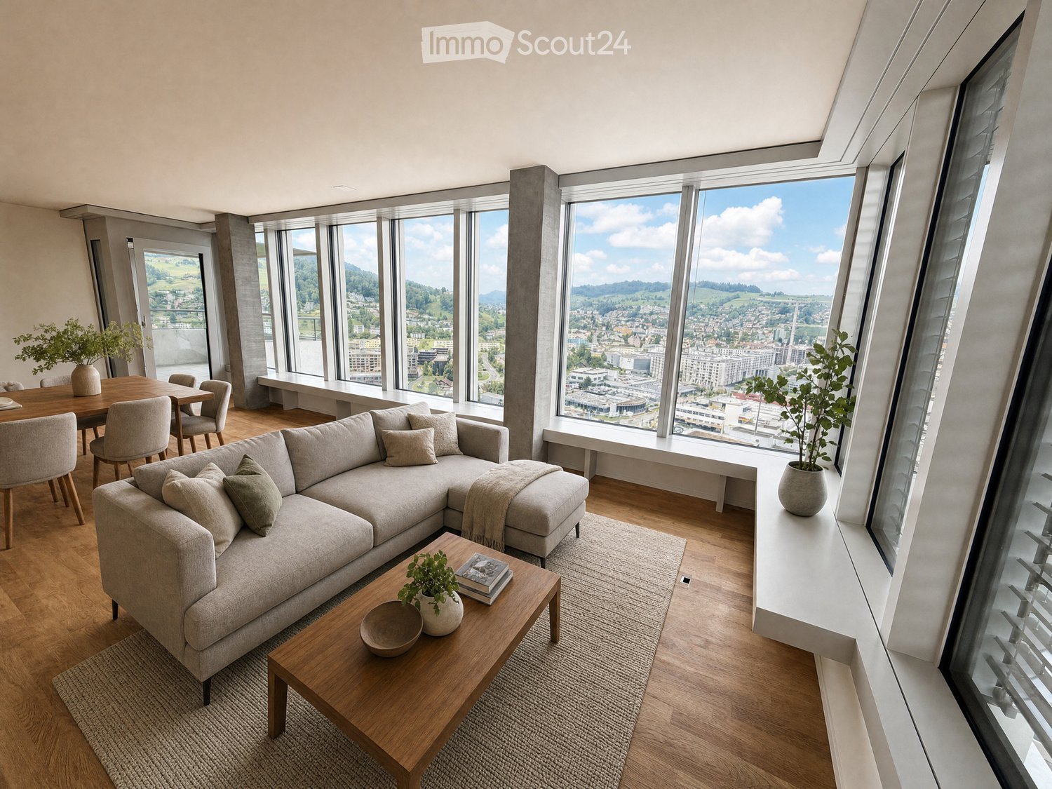 Modern living room with large windows offering a scenic view, featuring a grey sectional sofa, wooden coffee table, dining area with chairs, and decorative plants.