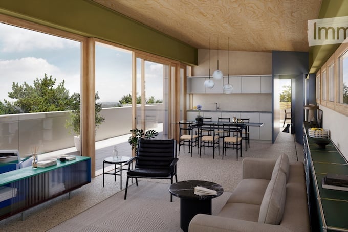 Modern open-plan living and dining area with large windows offering a scenic view, featuring a sofa, coffee table, dining table with chairs, and a sleek kitchen area with pendant lights.