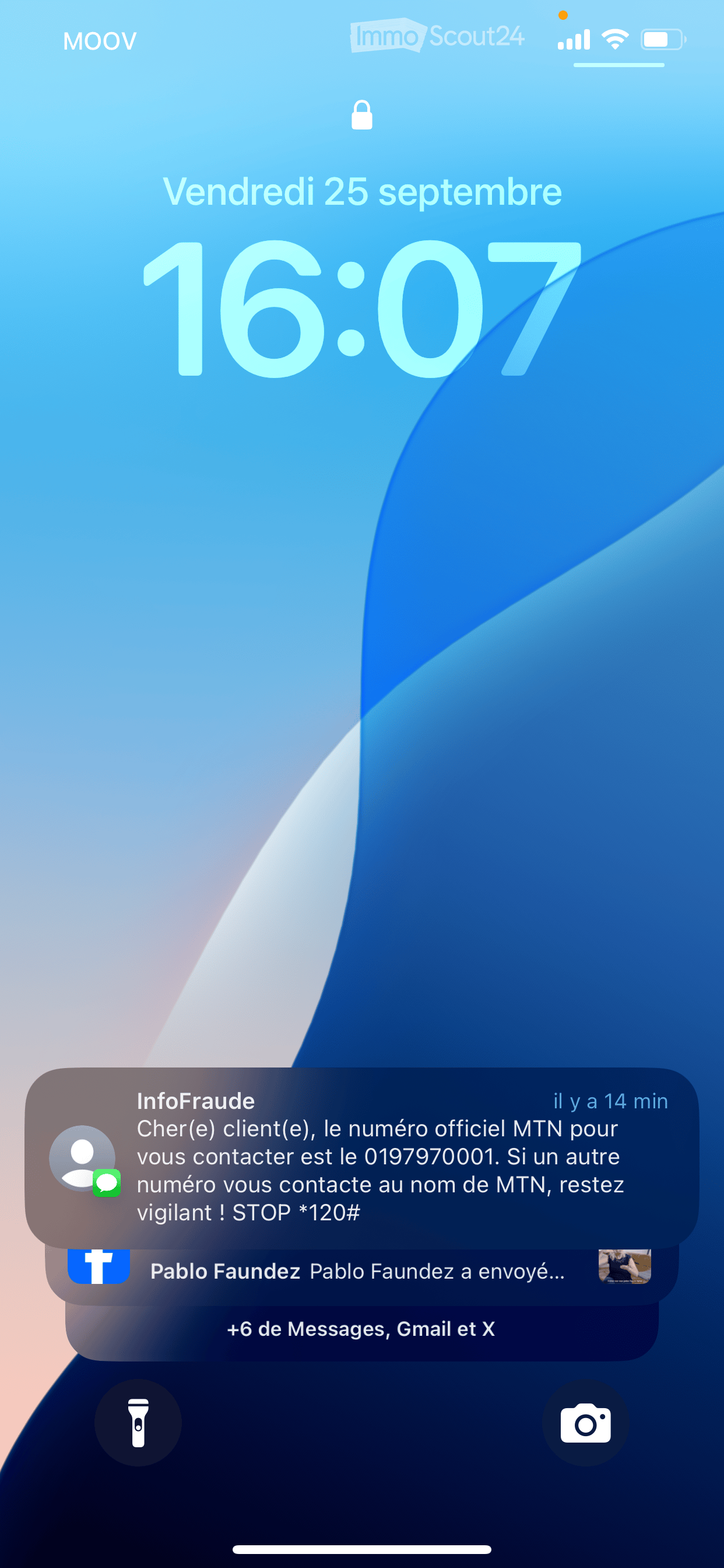 Notification screen showing a message from 'InfoFraud' with a warning about official MTN contact number and a timestamp of 14 minutes ago.