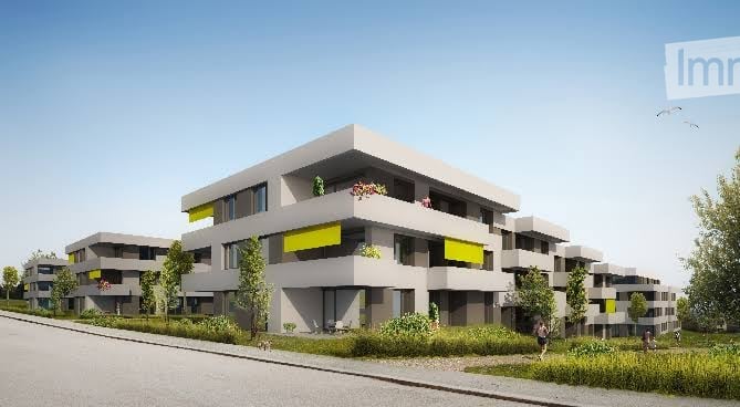 Modern multi-story residential building with clean lines, grey facade, yellow accents, and balconies with small gardens.