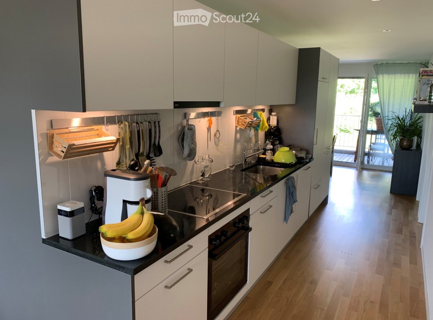 {"type": "Kitchen", "objects": ["coffee maker", "bowl of bananas", "oven", "sink", "faucet", "toaster", "cupboard", "fridge", "oven", "faucet", "sink", "oven", "cupboard", "cupboard", "cupboard", "cupboard", "cupboard", "cupboard", "cupboard", "cupboard",
