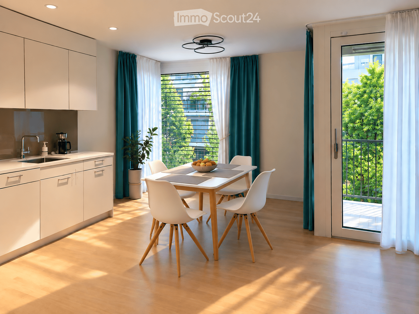 Modern kitchen and dining area with white cabinets, a wooden dining table with white chairs, a coffee maker, and a view of greenery through large windows and a sliding glass door leading to a balcony.