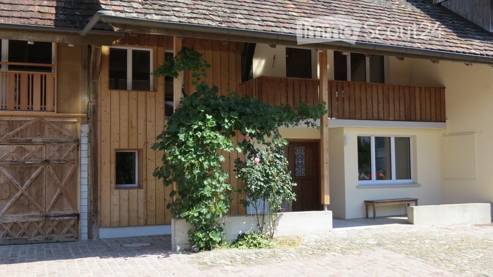 Wooden exterior, two floors, balcony, large wooden door