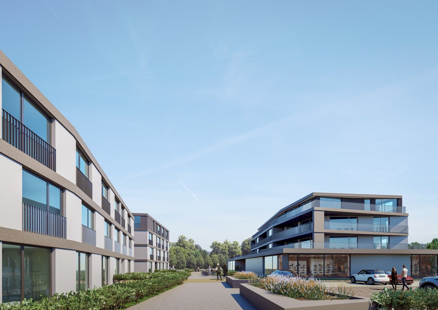Modern multi-story apartment buildings with balconies, surrounded by landscaped gardens and walkways. Parking spaces are visible in the foreground.