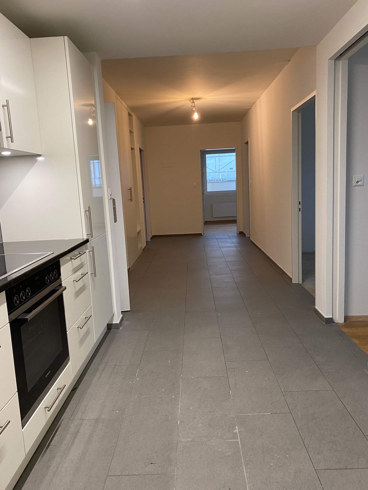 Kitchen, hallway to living room, bedroom, bathroom, elevated ground floor