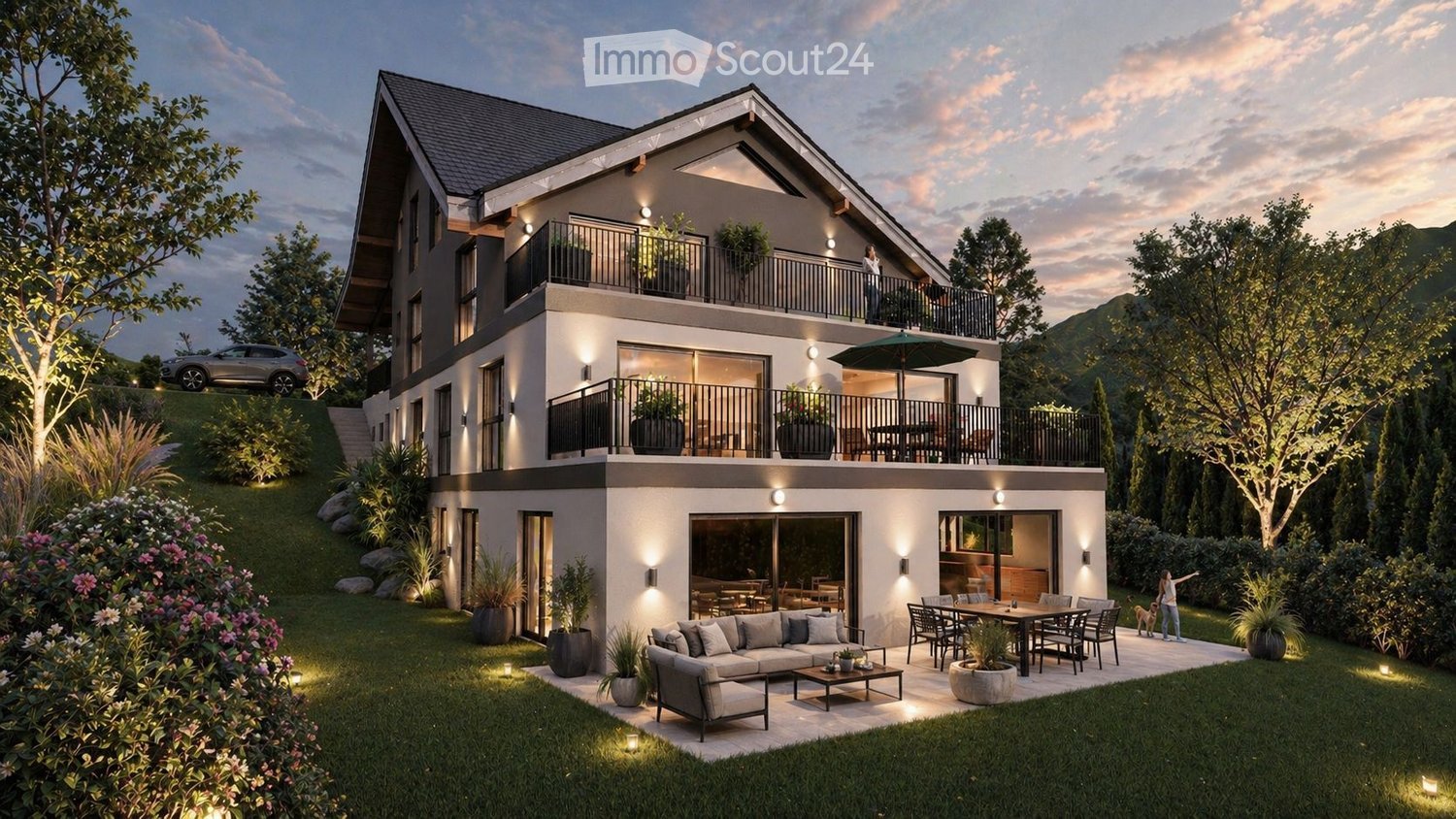 Modern two-story house with balconies, large windows, and a well-maintained garden. Features include a raised ground floor, outdoor seating area, and a parking space.