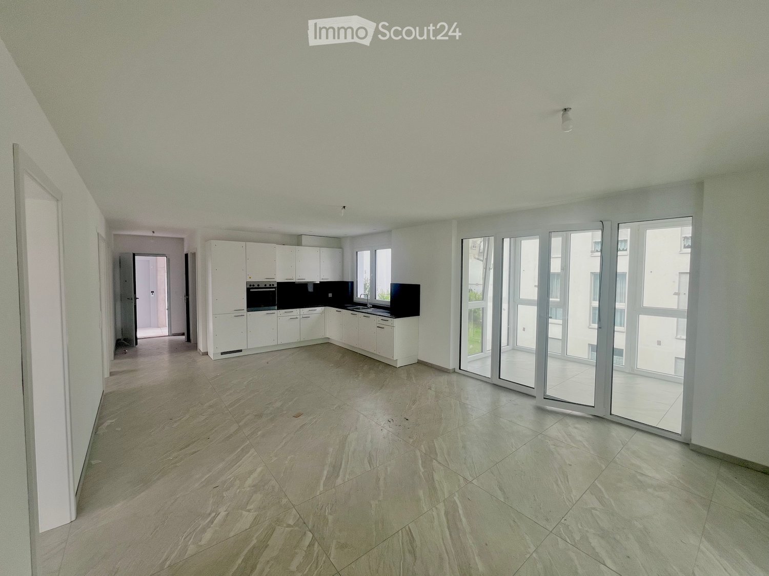 Modern open kitchen, large windows, balcony