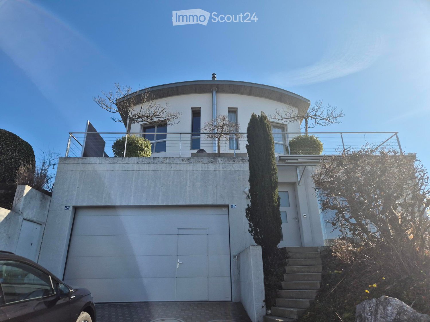 modern house, white color, curved roof, garage, balcony, chimney