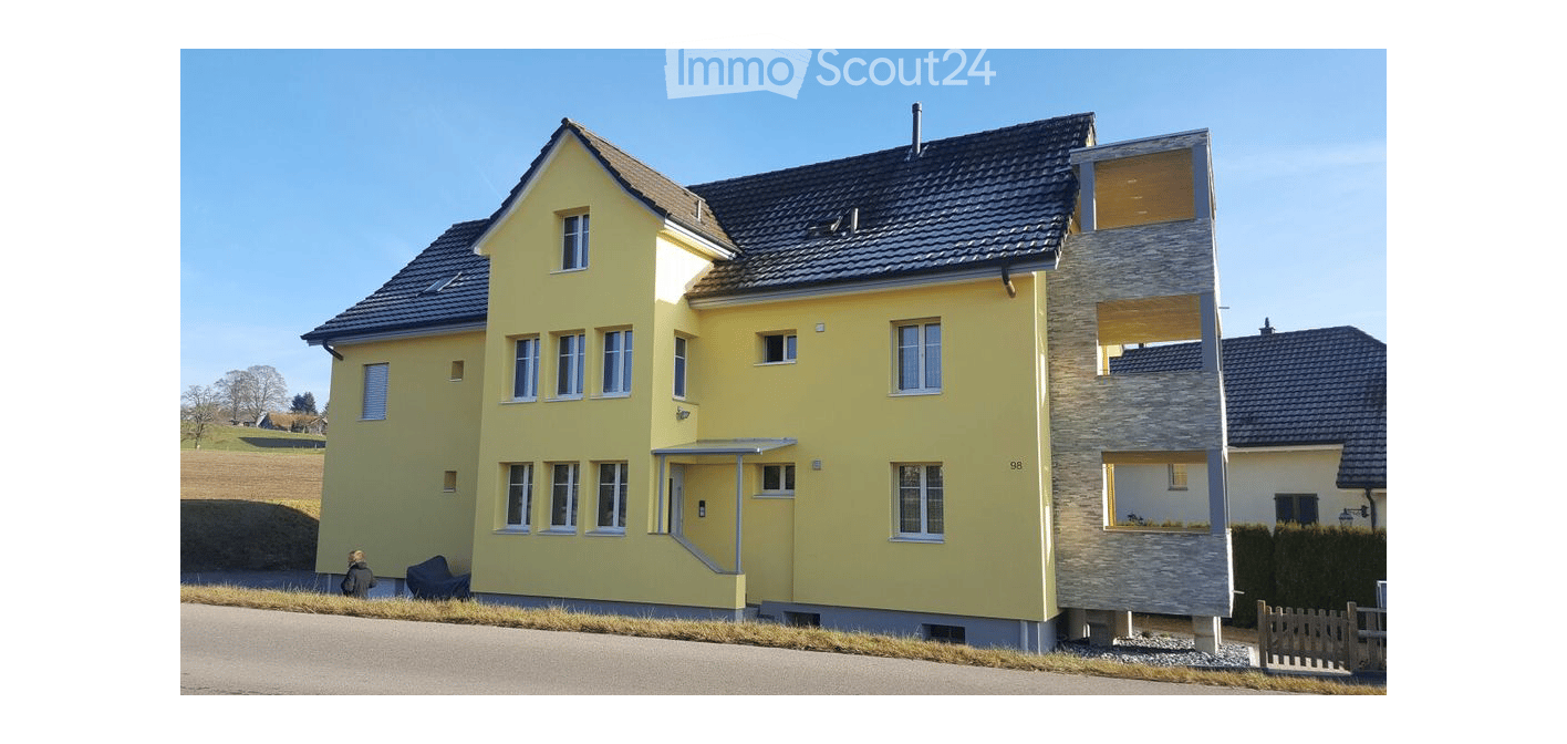3 story house, yellow painted, windows with white trims, grey foundation
