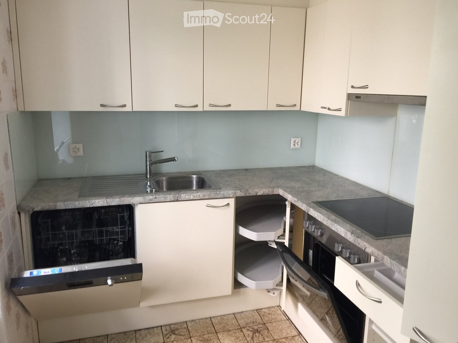 white cabinets, granite countertop, stainless steel sink, dishwasher, faucet, electrical outlets, gas stove