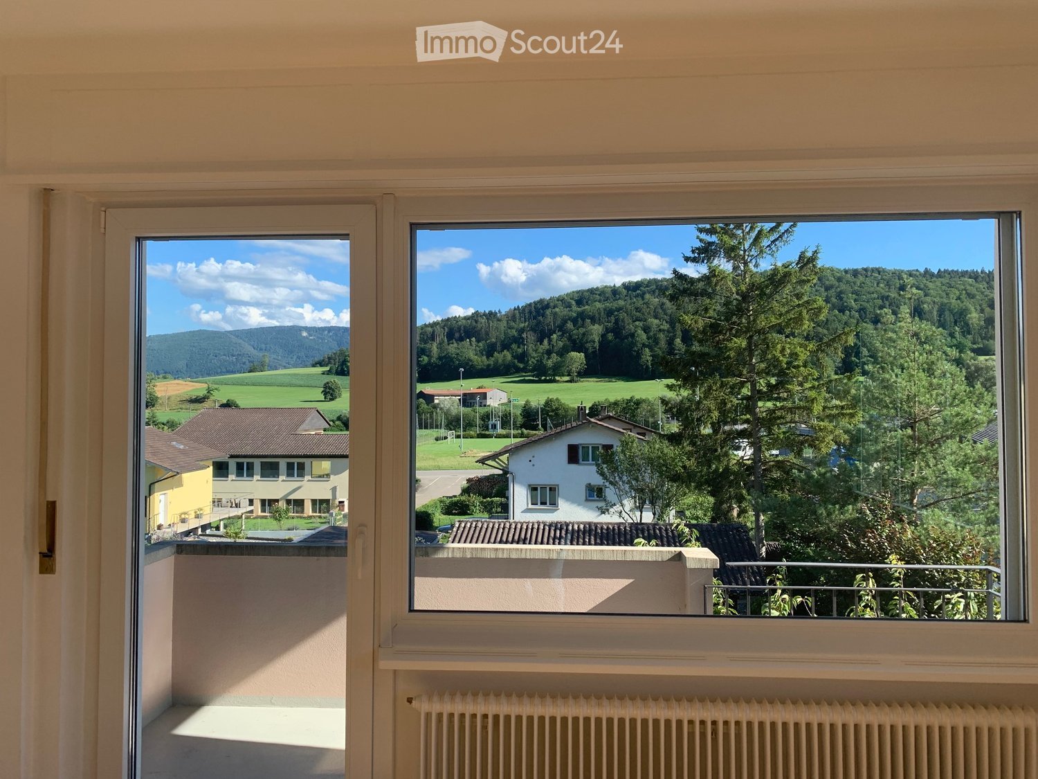 sliding doors, balcony, view of the valley and trees
