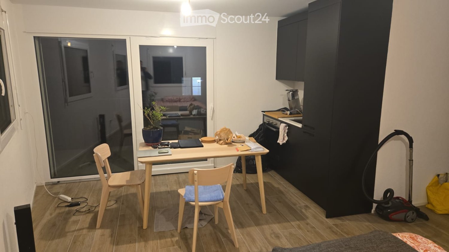 kitchenette, small dining area, small living area, wooden floor, sliding doors