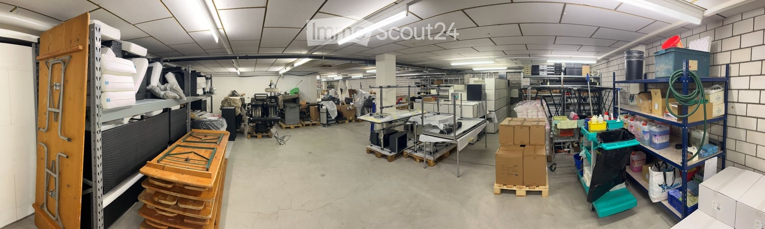 Storage with racks, boxes, storage boxes, machines, and various items.