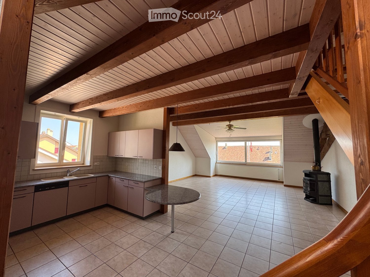 wooden beams, tile floor, countertop, sink, dishwasher, stove, windows, fireplace