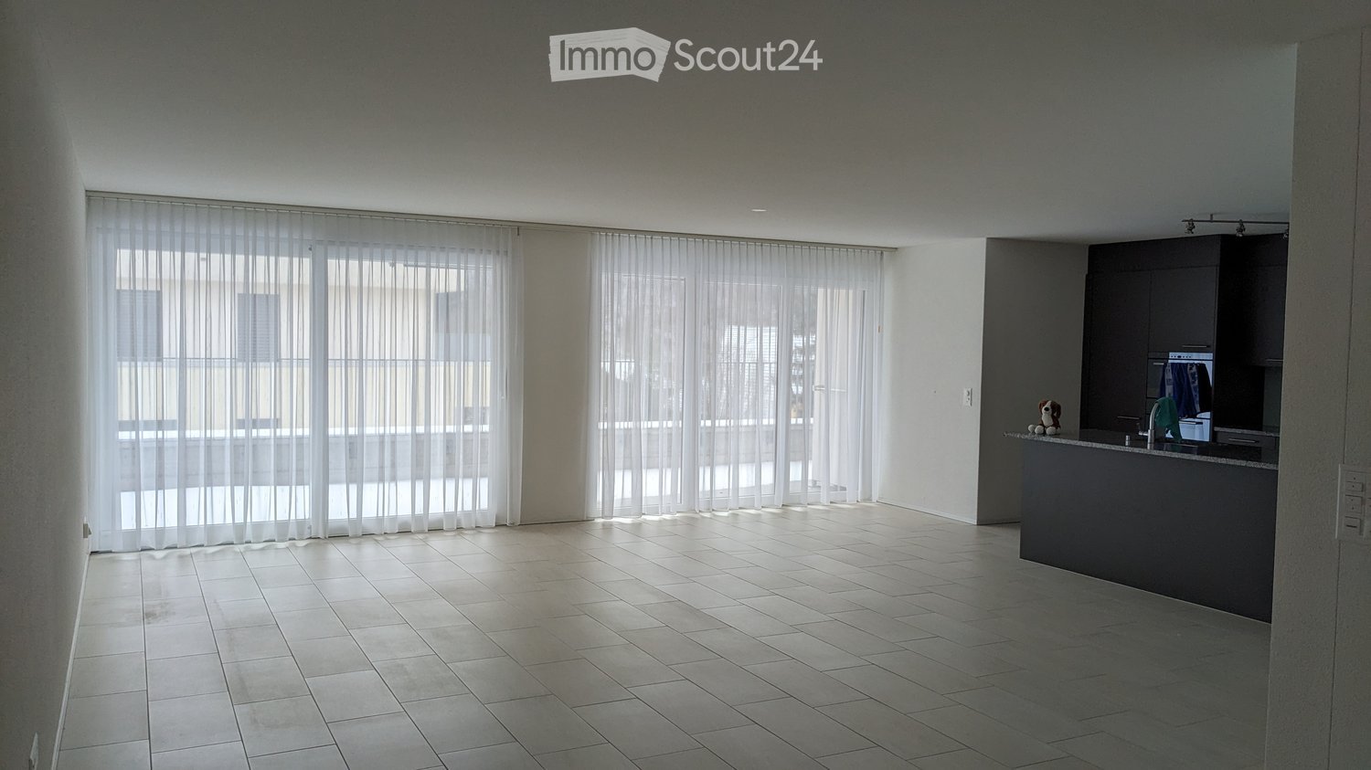 tiled floor, modern and minimalist, two large windows, balcony with view