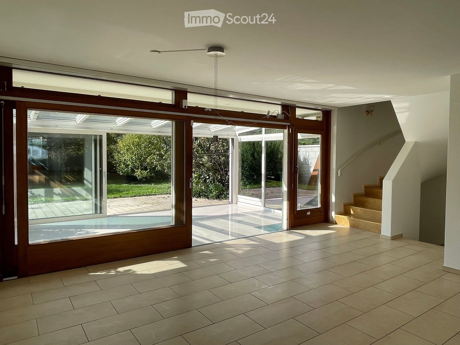empty room with sliding glass doors and wooden floor