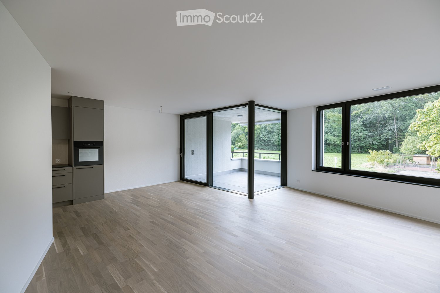empty room, wooden floor, sliding glass door, large windows, balcony