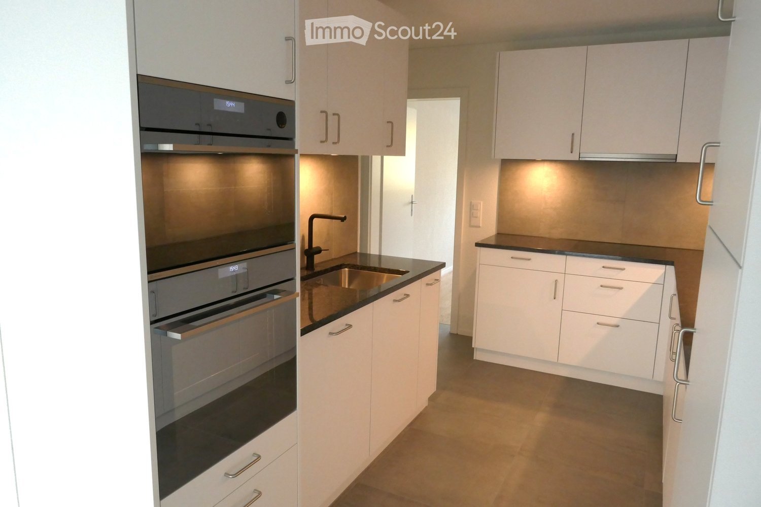 stainless steel dishwasher, stainless steel oven, white cabinets, granite countertops, white appliances