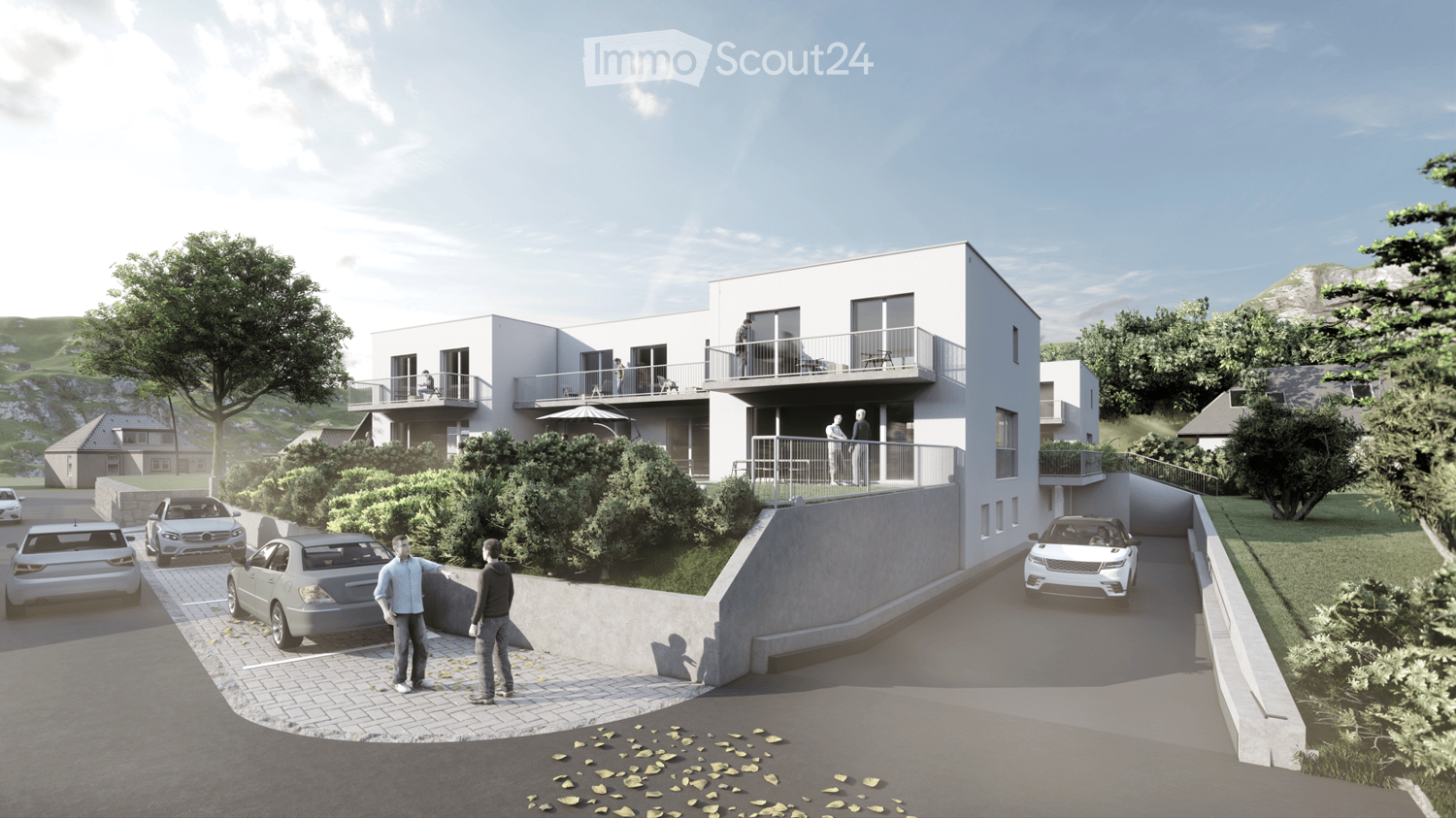 White house, white walls, grey roof, 3 balconies, 3 cars parked