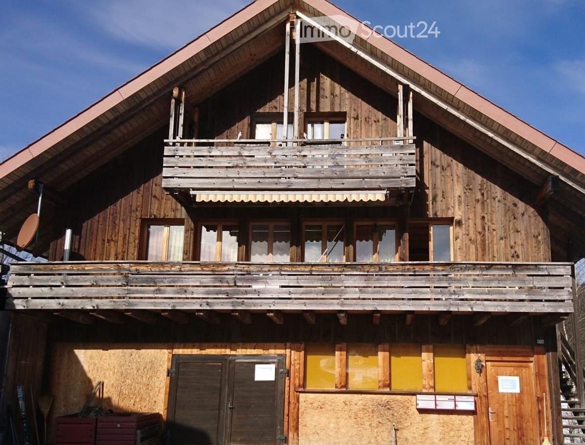 wooden house, gable roof, 2 balconies, garage, doors, windows