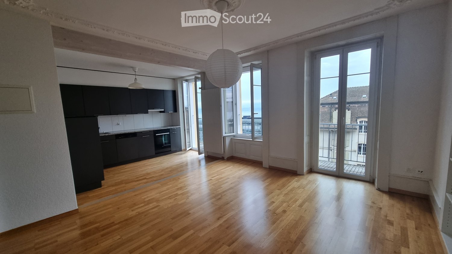 modern design, wooden floors, open kitchen, double doors leading to balcony, built-in cabinets, dishwasher, oven