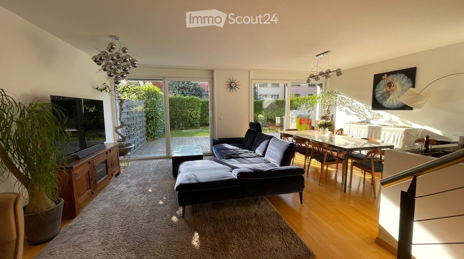 leather couch, L-shaped couch, TV stand, large windows, balcony, chandelier