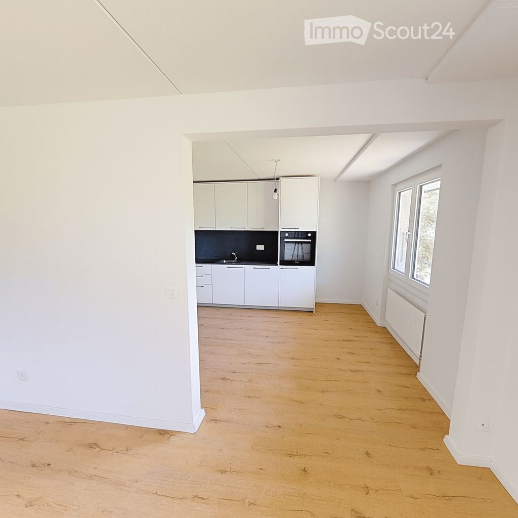 empty room, kitchen, white cabinets, black countertops, integrated oven, white tiled floor