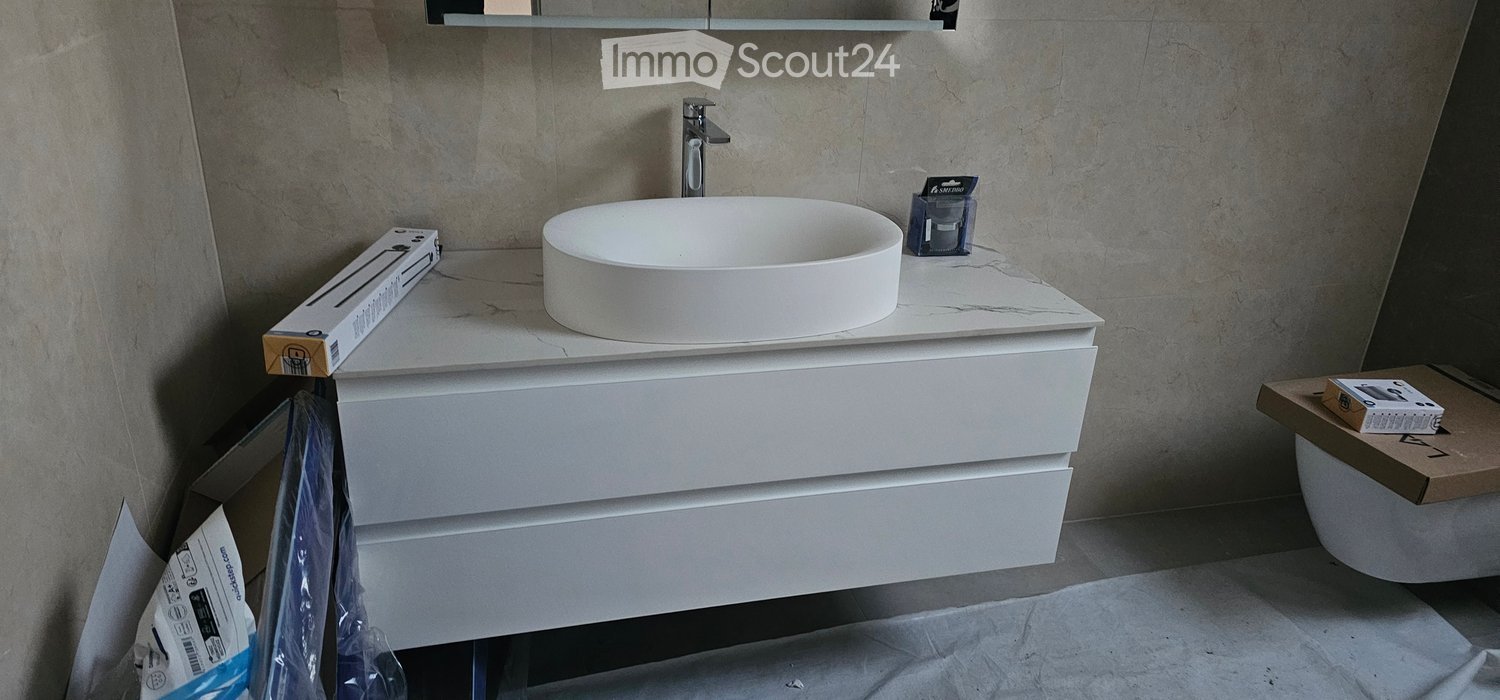 Sink, toilet, vanity, tiled wall