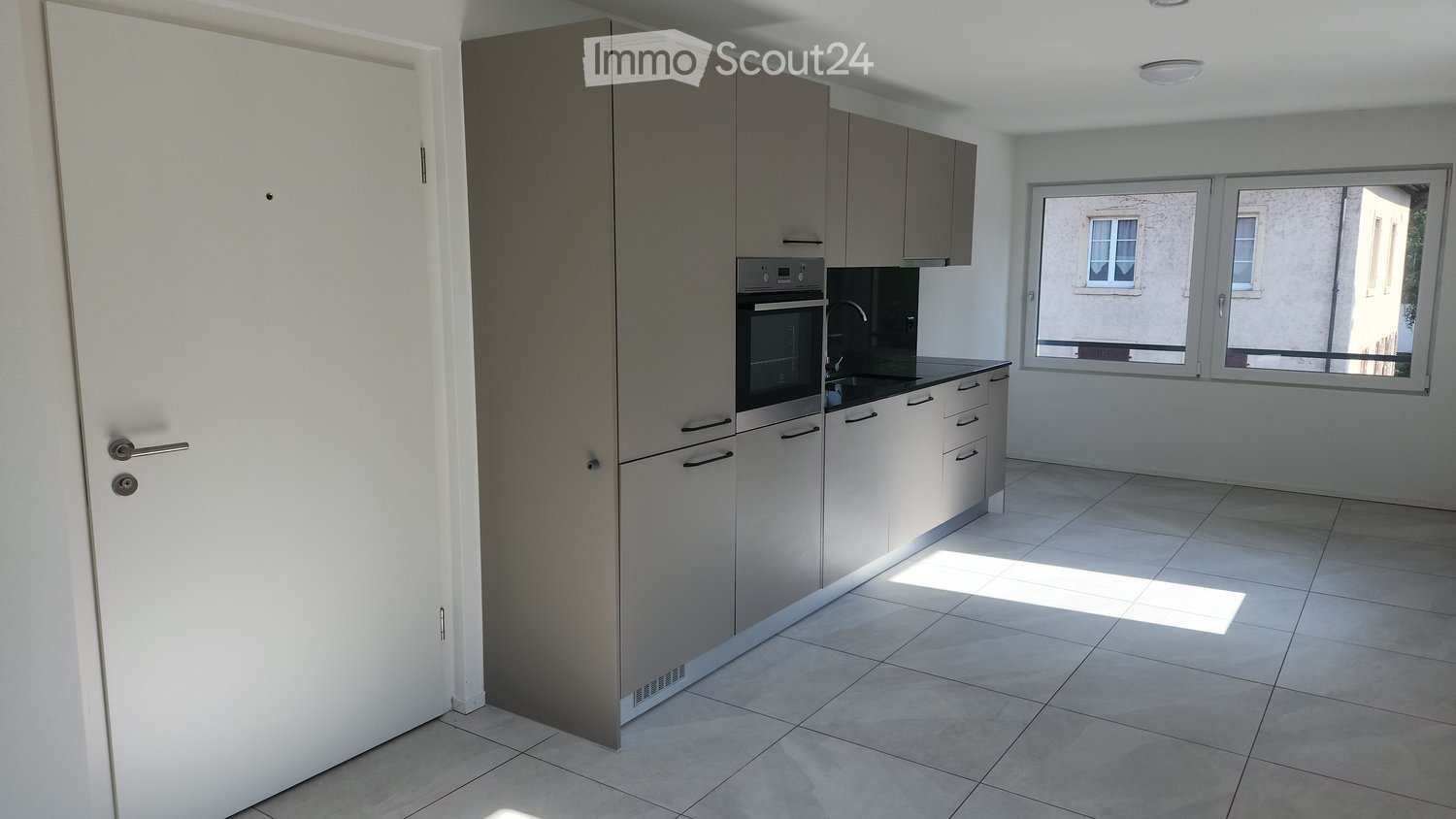 modern kitchen, built-in oven and sink, gray cabinets, tiled floor, open window, stainless steel sink