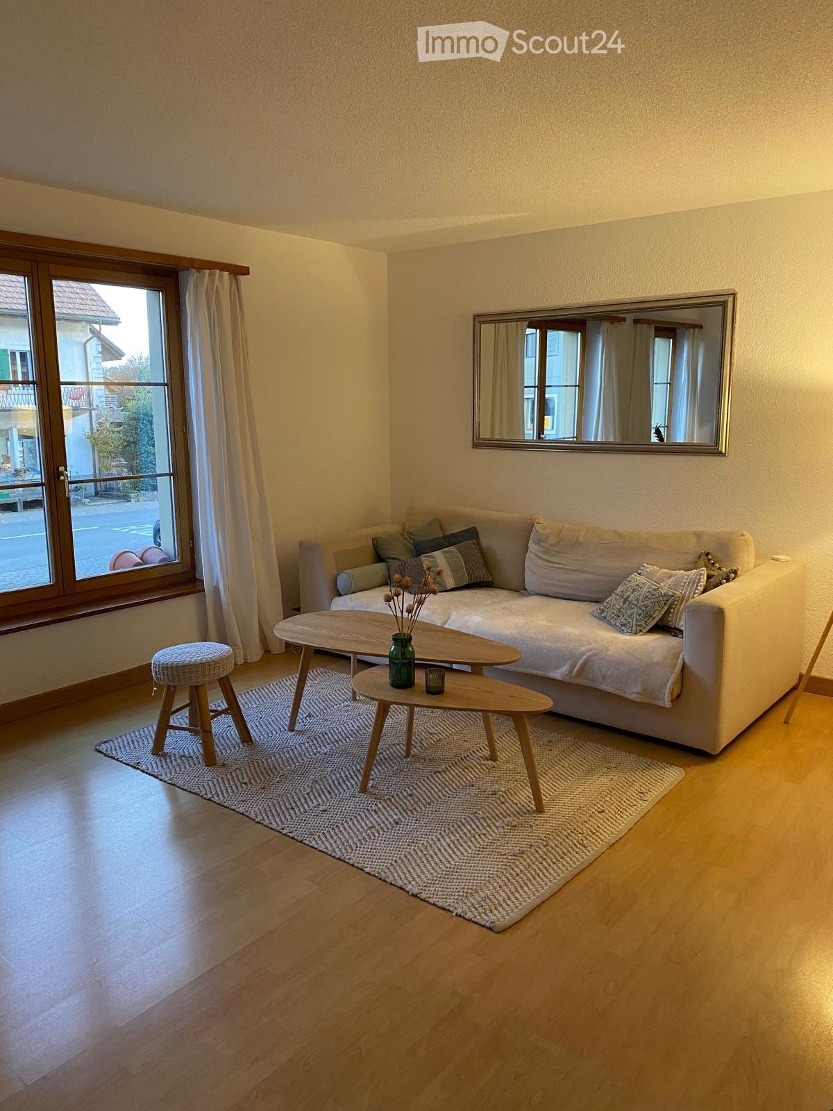 sofa, coffee tables, wooden stool, area rug, mirror, curtains