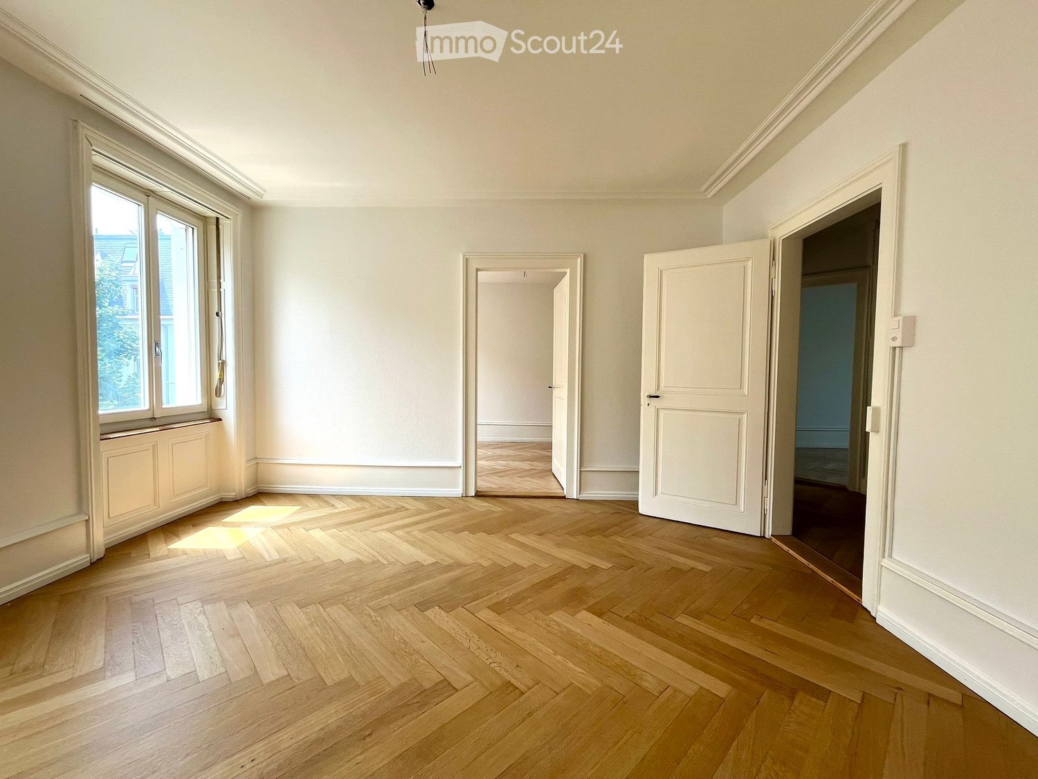 empty room, wooden floor, white walls, large windows, doorways