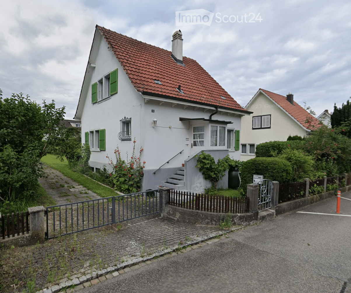 2 story house, red roof, white wall, green shutters, driveway, fence, steps