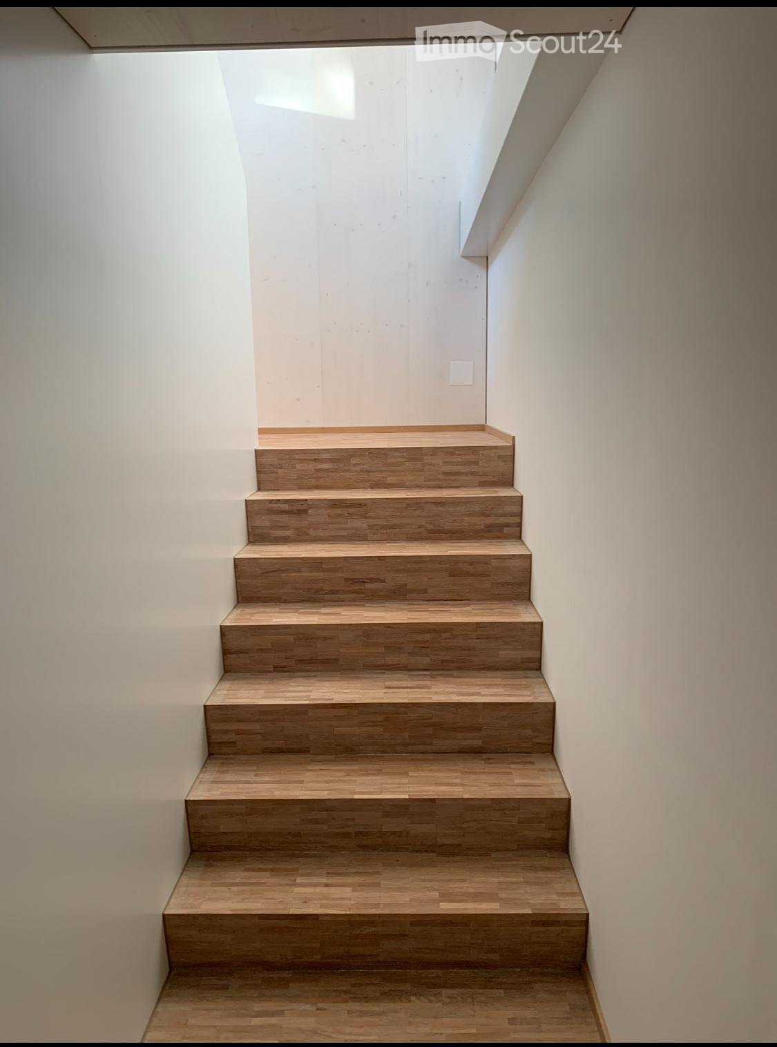wooden staircase, white walls