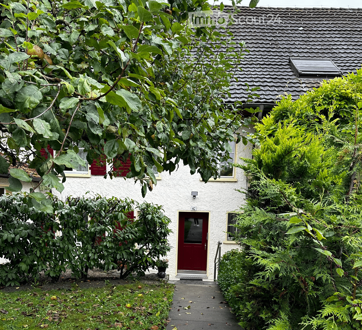 white house, red doors and shutters, brown roof, chimney