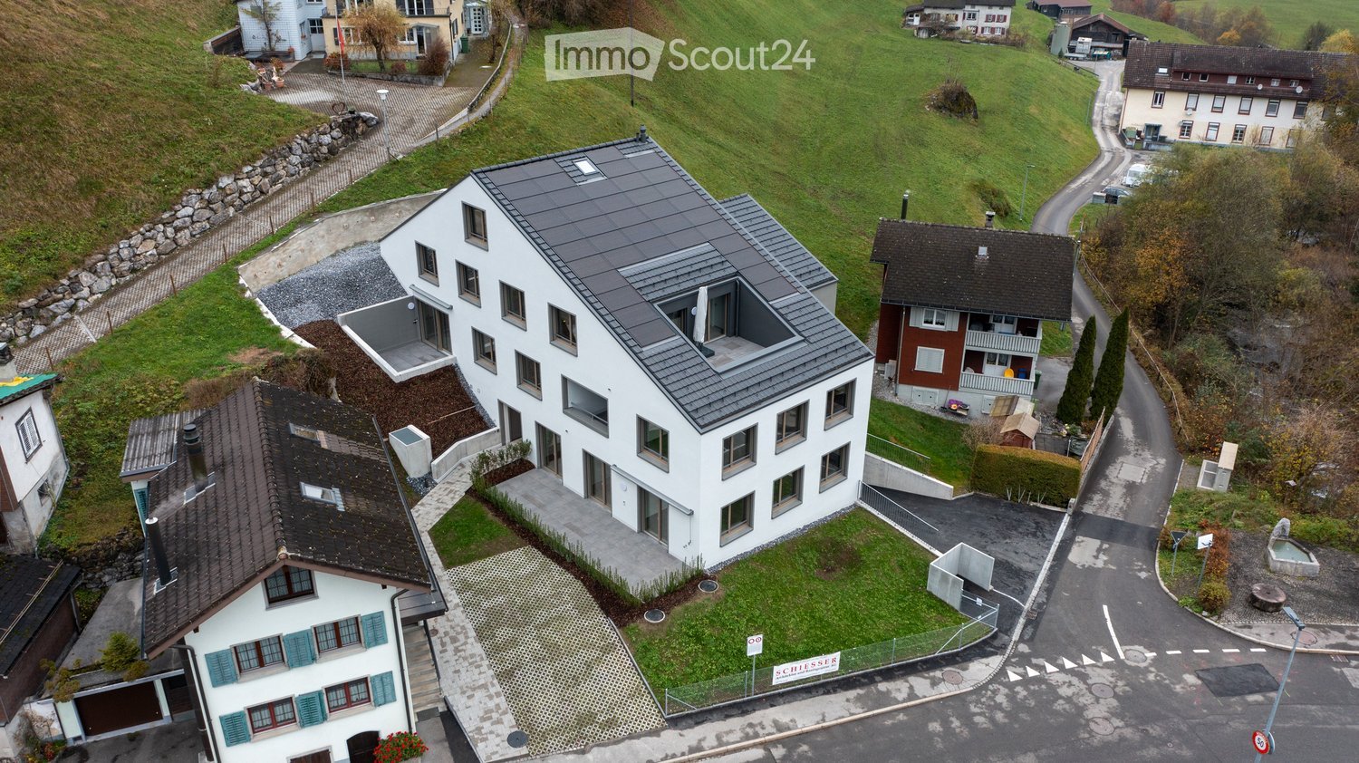 modern house, white exterior, solar panels, landscaped garden, swimming pool