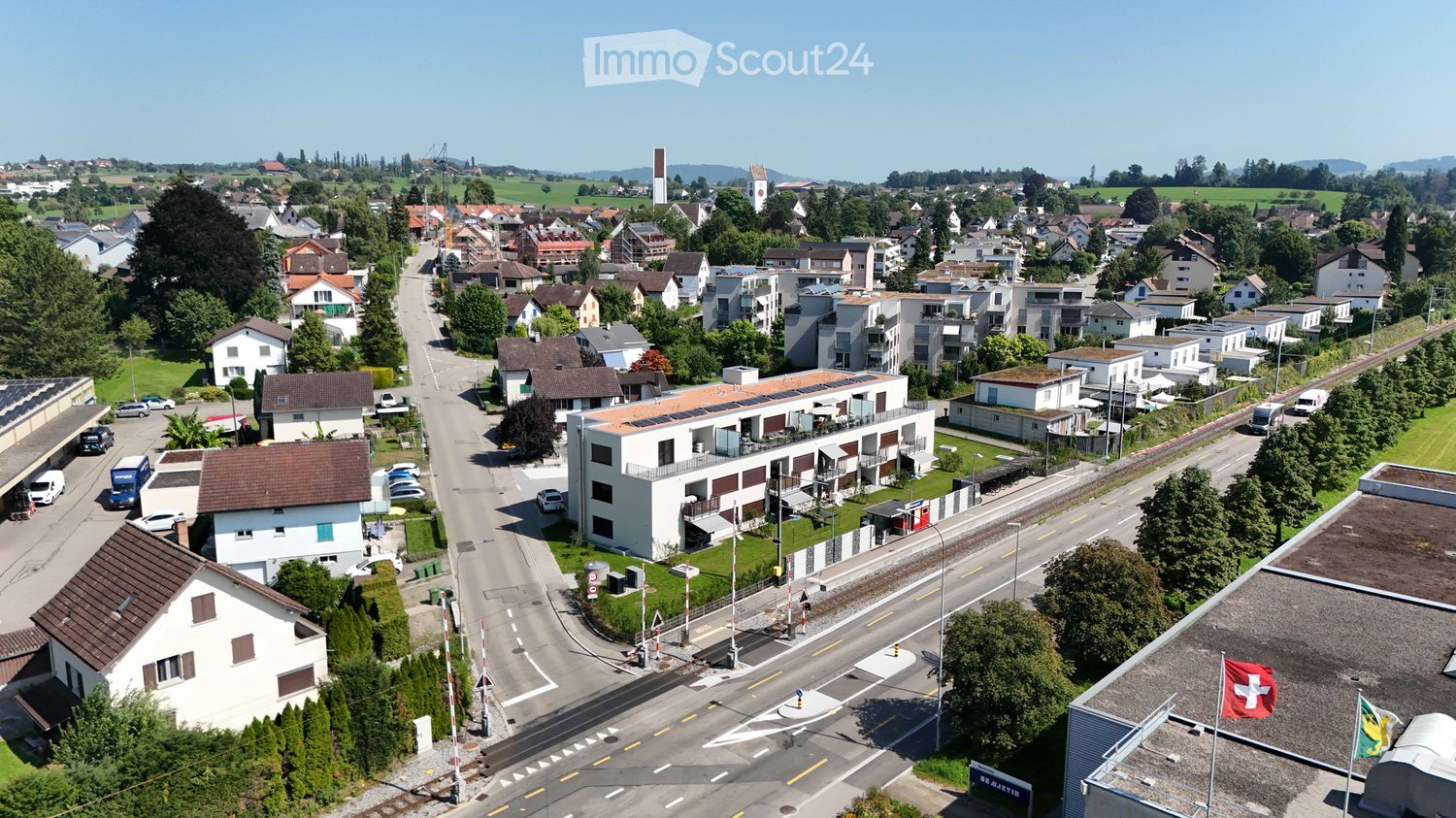 row of houses, single family homes, trees, parked cars, roads, solar panels