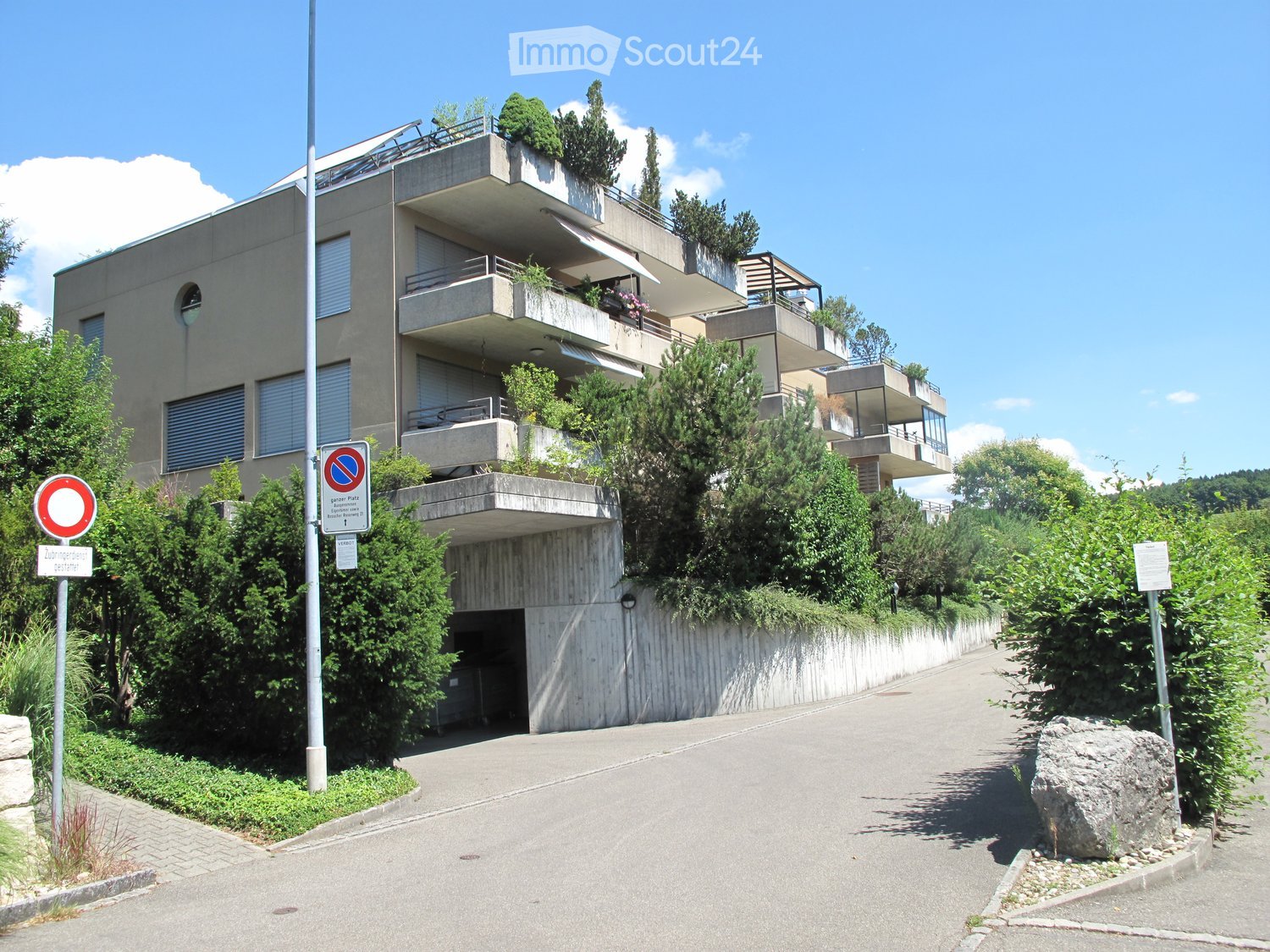 multi story building, balconies, underground garage