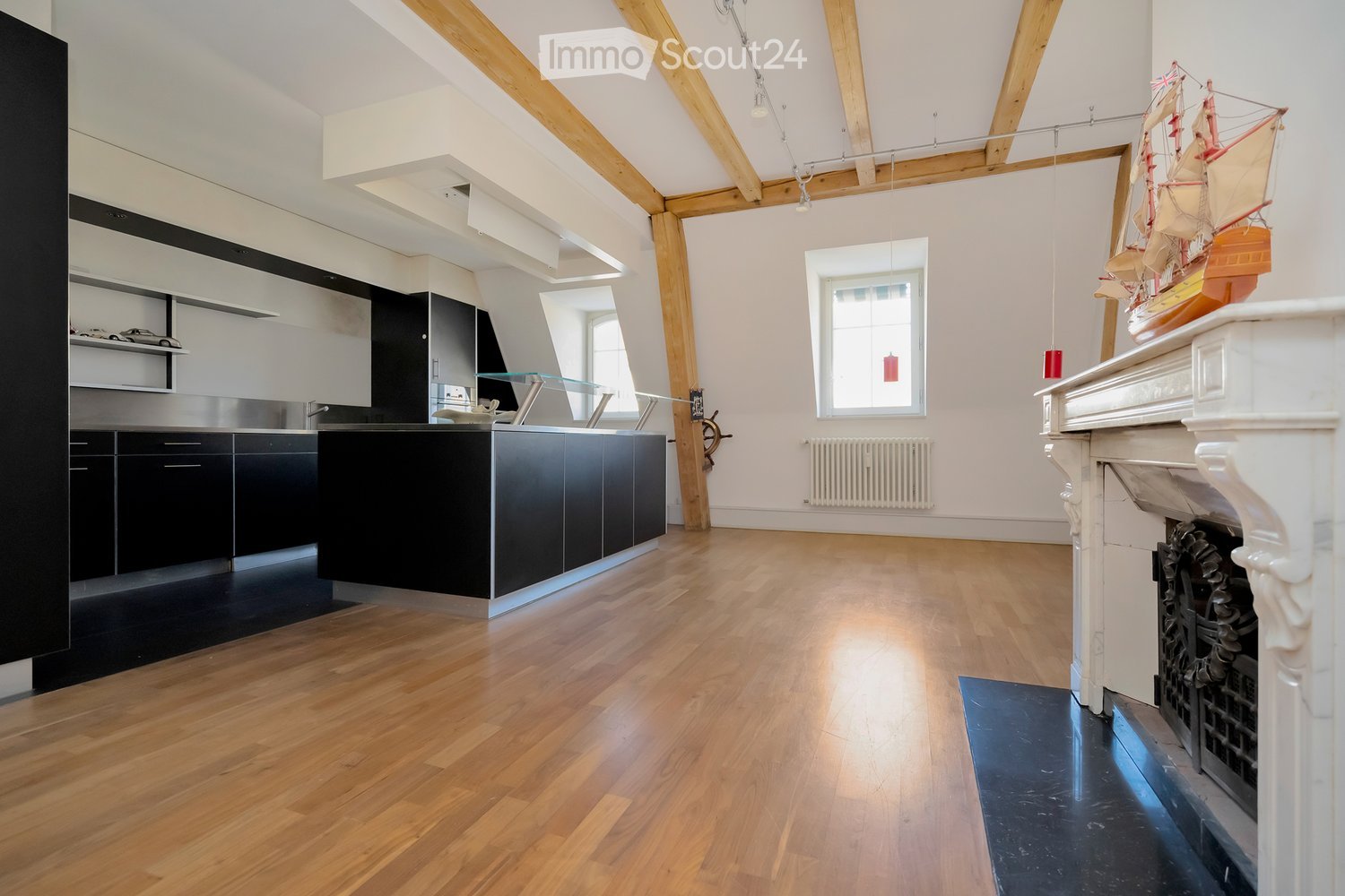 modern kitchen, fireplace, wooden floors, black and white decor