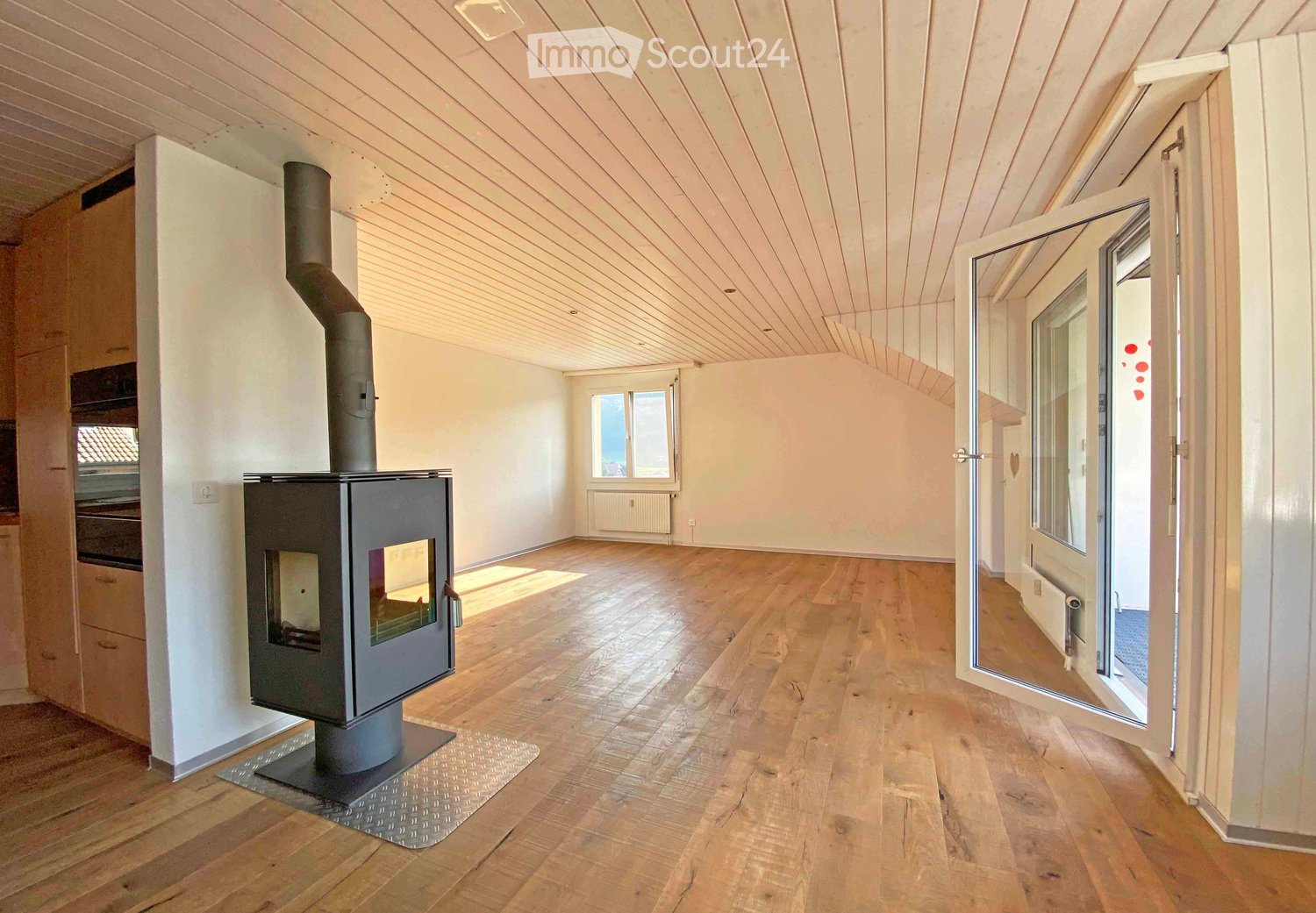 wooden floor, fireplace, open doors, wooden beams, sliding glass doors