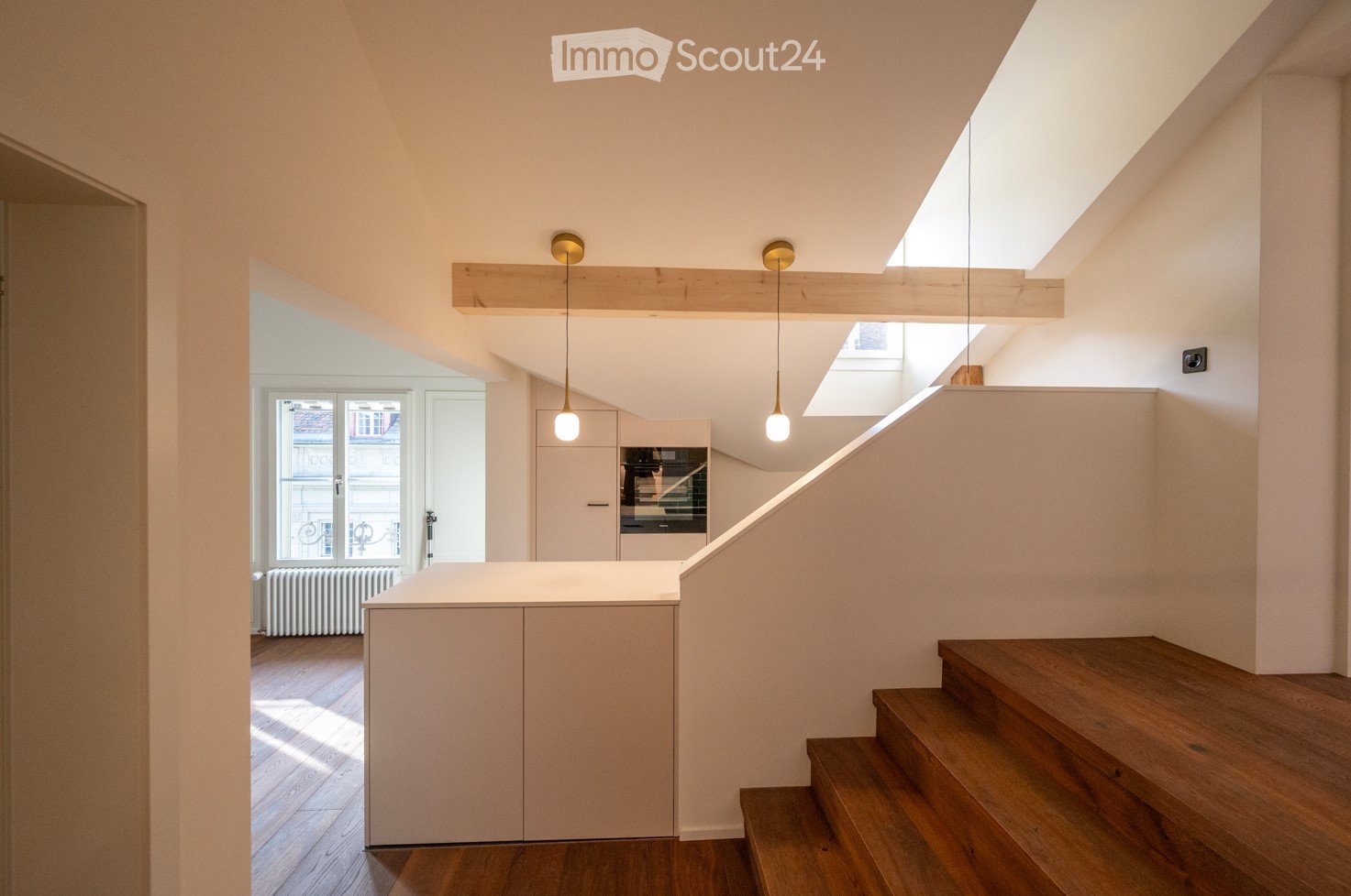 modern design, white walls, wooden floor, central staircase, open kitchen, loft space
