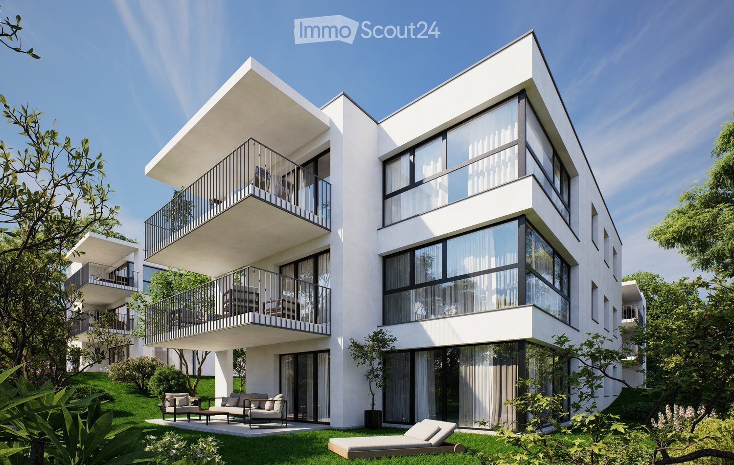 Modern, 2-story apartment building with large glass windows, balconies, and outdoor seating area