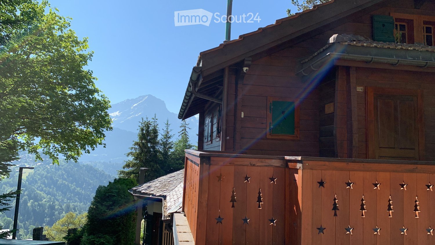 Wooden chalet style house, balcony, mountain views