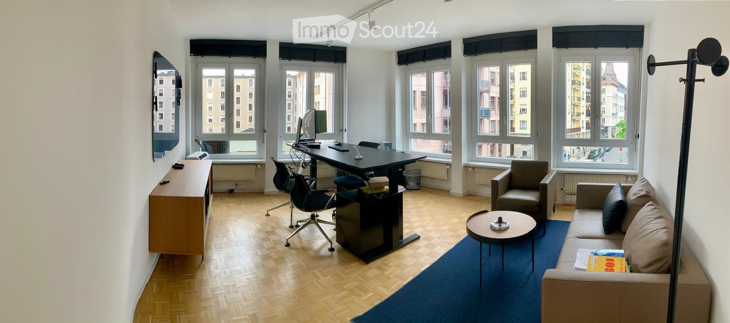 hardwood floor, desk, monitor, armchair, sofa, table, bookcase, radiator
