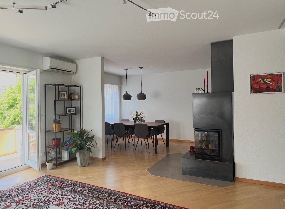 wooden floor, fireplace, glass door, rug, furniture, plant