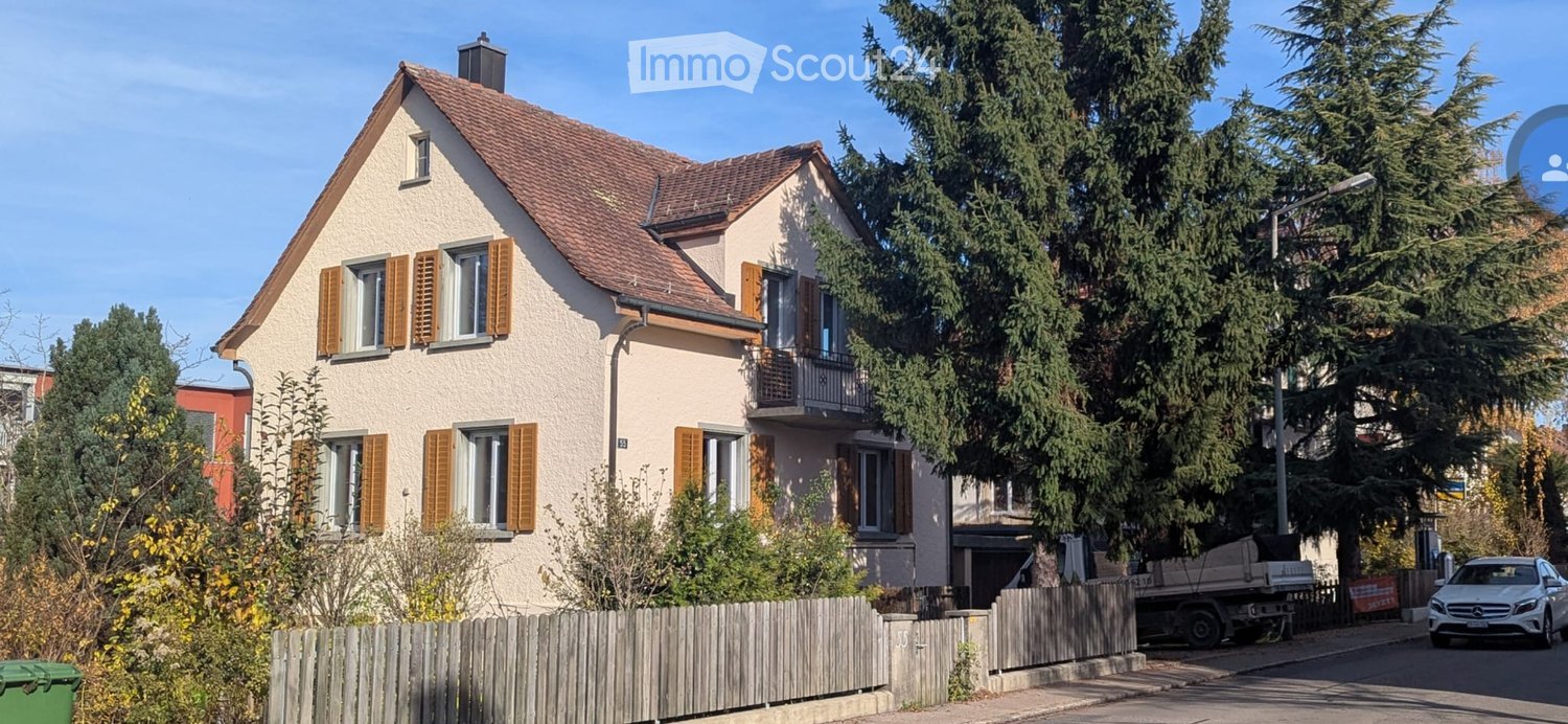 3 story house, beige facade, brown roof, brown shutters, terrace, garden, trash bin, truck on the street
